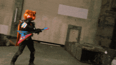a person in a costume is holding a guitar in a room