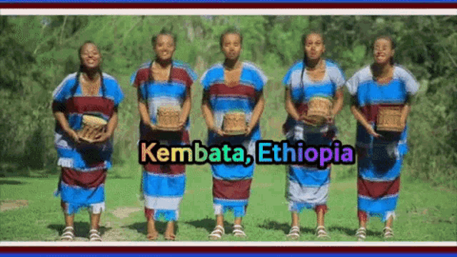 a group of women standing in a field with the words kembata ethiopia on the top