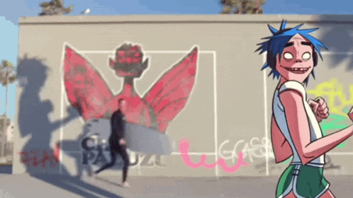 a cartoon character is standing in front of a wall with graffiti on it .