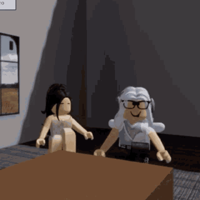 two roblox characters are standing next to each other in a room .