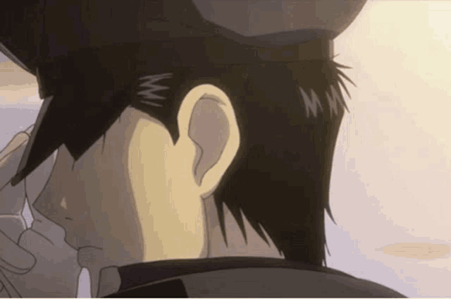 a close up of a man 's ear with the letters mm on it