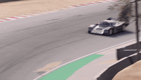 a racing porsche number 17 is driving down a track