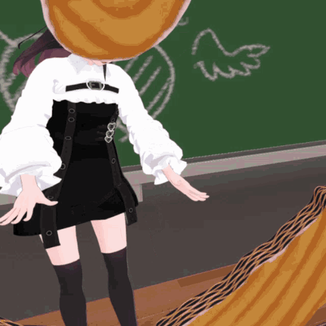 a girl with a pancake on her head standing in front of a blackboard