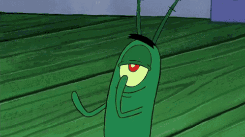 a green cartoon character with a red eye