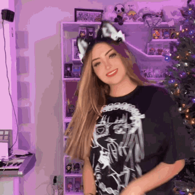 a girl wearing a cat ear headband and a black shirt