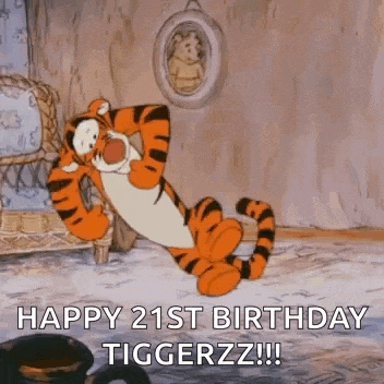 tigger from winnie the pooh is laying down in a chair .
