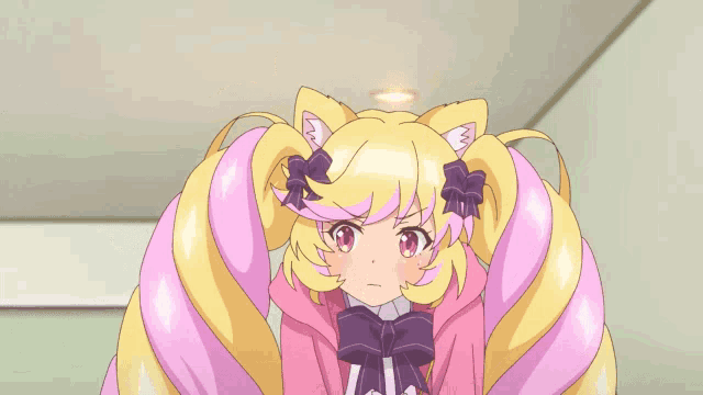 a girl with a cat ear is making a stop sign
