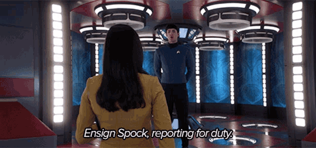 a man and a woman in a room with the words ensign spock reporting for duty on the bottom