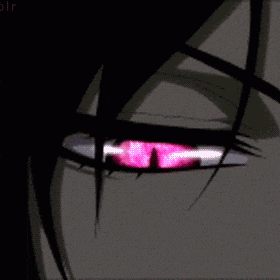 a close up of a person 's eye with a pink light in it