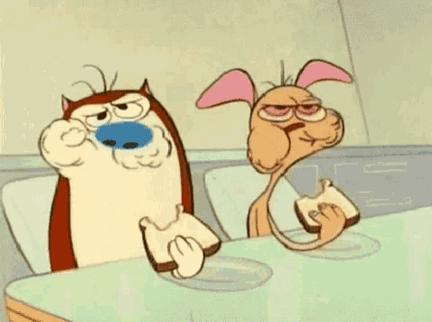 two cartoon characters , a cat and a dog , are eating sandwiches at a table .