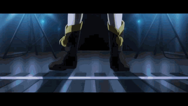 a person wearing a pair of brown boots standing on a wooden floor