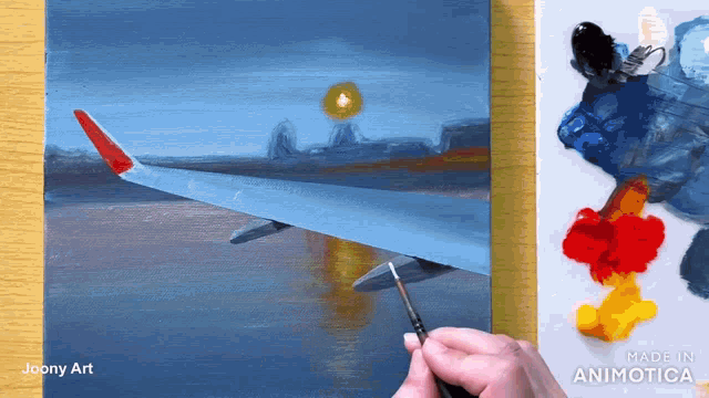 a painting of an airplane wing is being painted by joony art