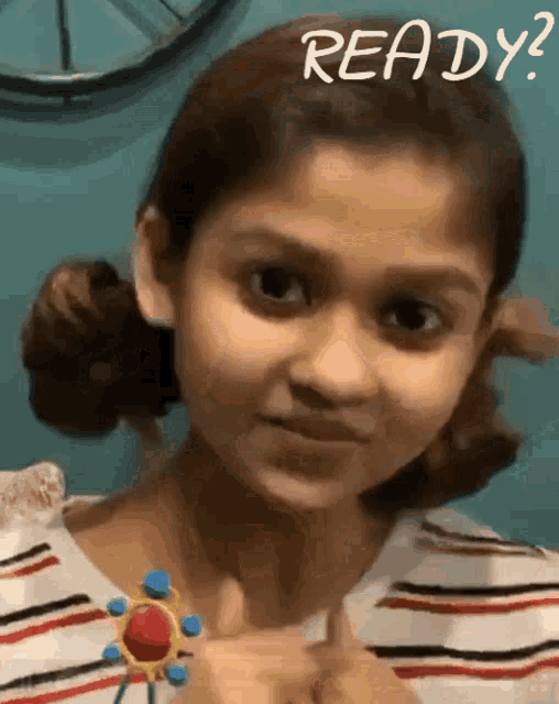 a little girl is giving a thumbs up with the words " ready " written above her