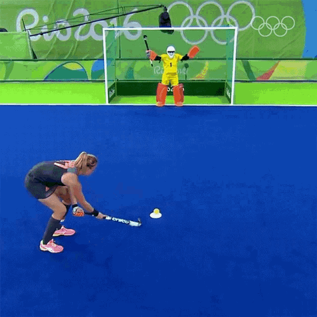 a field hockey game is underway at the rio 2016 olympic games