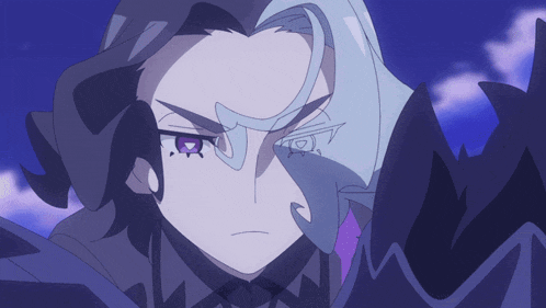 a close up of a person 's face with a purple eye