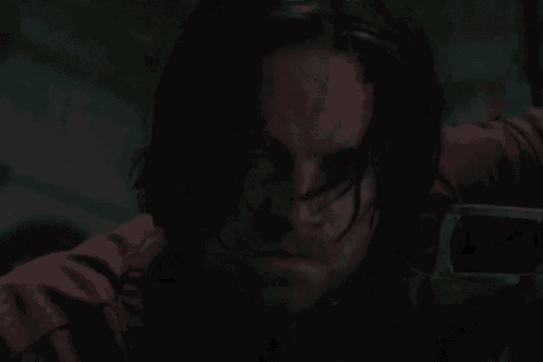a close up of a man 's face with blood on his face .