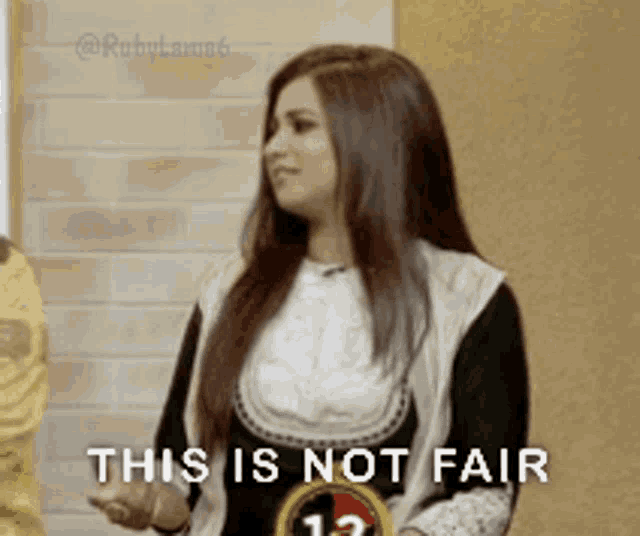 a woman in a black and white dress says this is not fair .