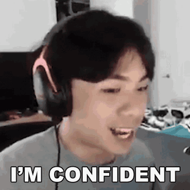 a man wearing headphones is saying `` i 'm confident '' while looking at the camera .