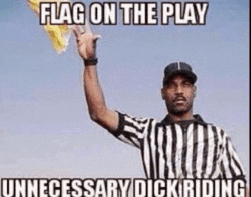 a referee in a striped shirt is holding up a yellow flag .