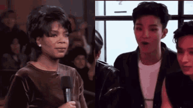 a woman is holding a microphone next to a man