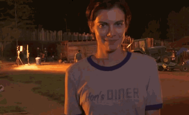 a woman wearing a shirt that says hen 's diner
