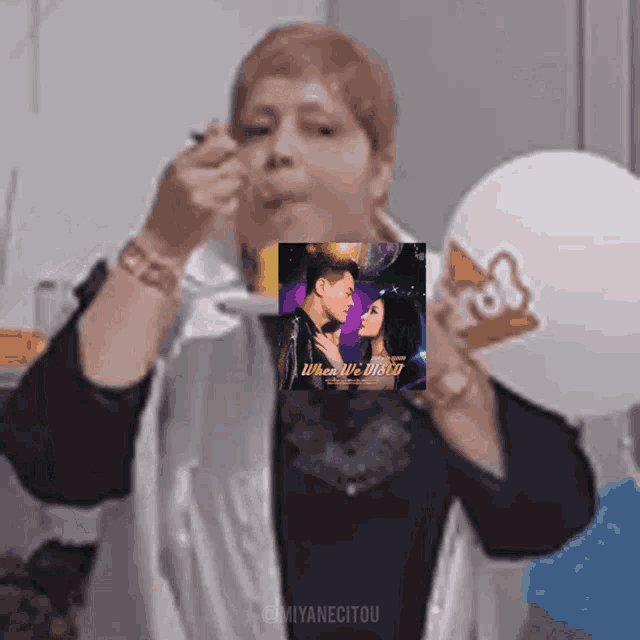 a woman is eating ice cream with a picture of a man and woman on it