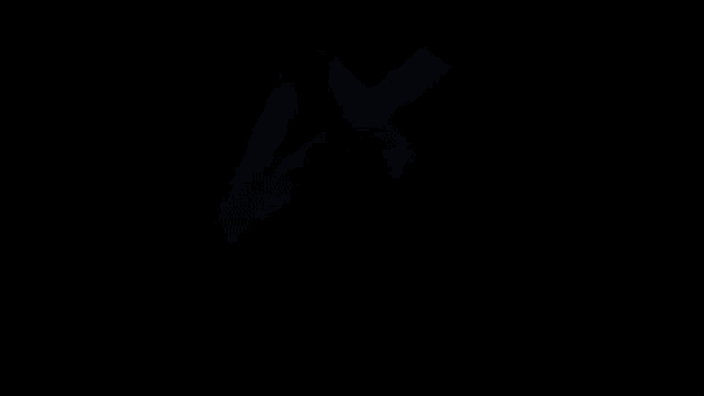 a close up of a yellow letter v on a black background .