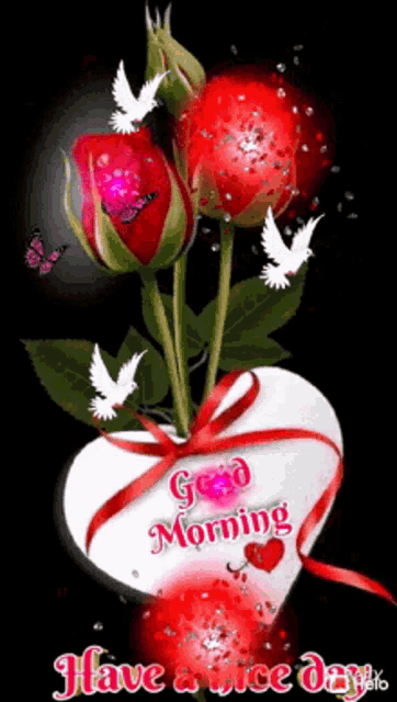 a bouquet of red roses in a heart shaped vase with the words `` good morning have a nice day '' written on it .