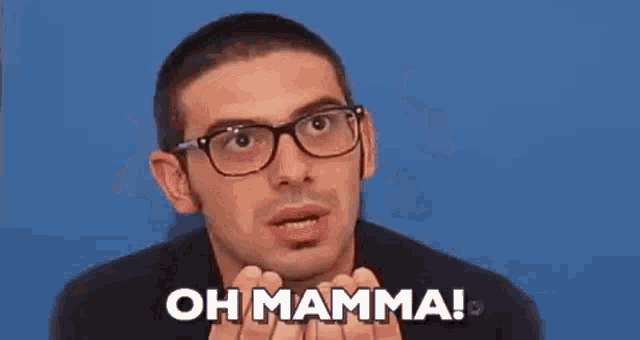 a man wearing glasses is holding his hands to his head and saying oh mamma .