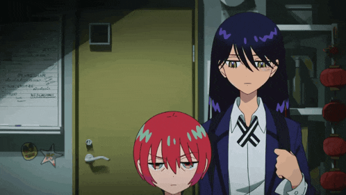 a girl with red hair is standing next to another girl