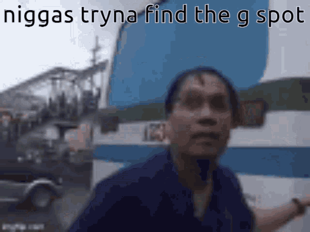 a blurry picture of a man with the words niggas tryna find the g spot above him