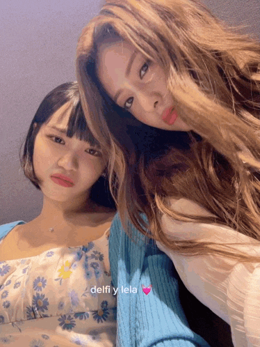 two girls are posing for a picture with the name delfi y lela written on the bottom