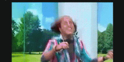 a pixelated image of a man in a cowboy hat dancing in a park
