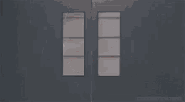 a man is peeking out of a door with the words `` i do have a huge rod '' .