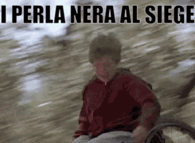 a person in a wheelchair with the words " i perla nera al siege " on the bottom