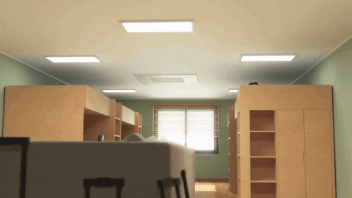 a bedroom with bunk beds and shelves and a window