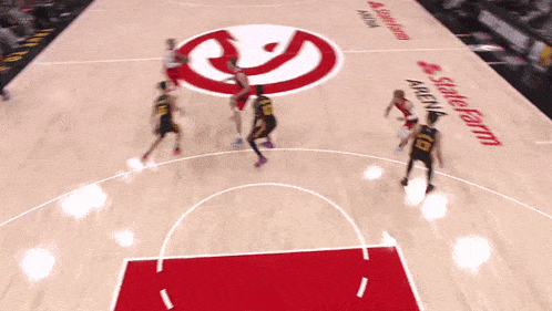 basketball players on a court with state farm arena written on it