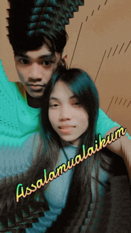 a man and a woman are posing for a picture with the words assalamualaikum written on the bottom