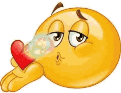 a cartoon smiley face is blowing soap bubbles and holding a red heart .