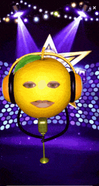 a lemon wearing headphones and a microphone on a stage with a star in the background