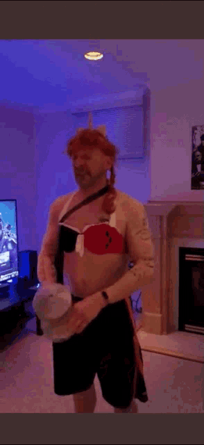 a person is dancing in a living room in front of a television .