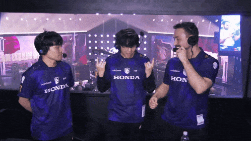 a group of people wearing purple honda jerseys