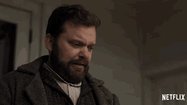 a man with a beard is on a netflix advertisement
