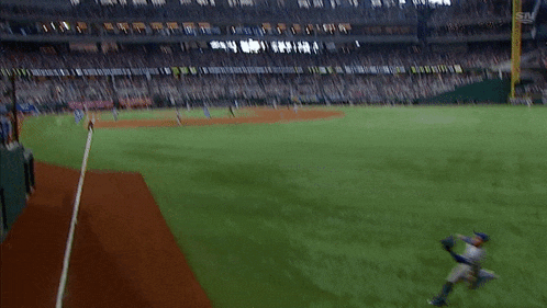 a blurry picture of a baseball game with the letters sn on the bottom