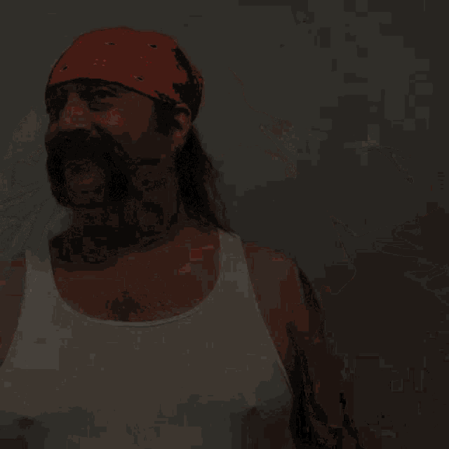 a man with a red bandana on his head