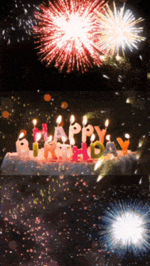 a birthday cake with candles that spell out happy birthday