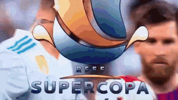 a soccer player stands in front of a trophy that says supercopa