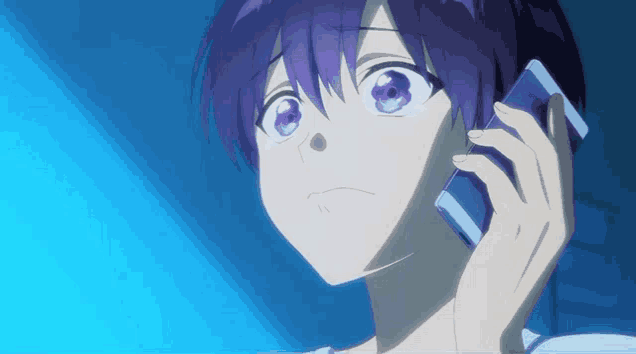 a person with purple hair is talking on a phone
