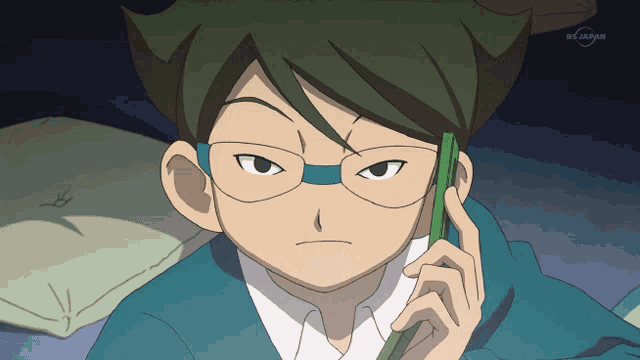 a cartoon character is talking on a cell phone with a bs japan logo behind him