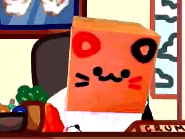 a person with a box on their head that says grum on the desk
